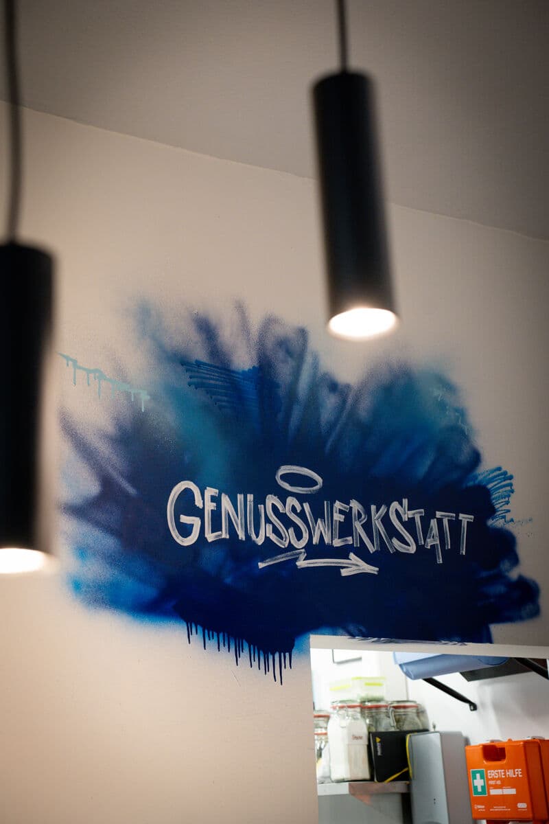 Genusswerkstatt-Schriftzug als Wandbild